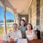 Angela with a wedding couple at the signing table.